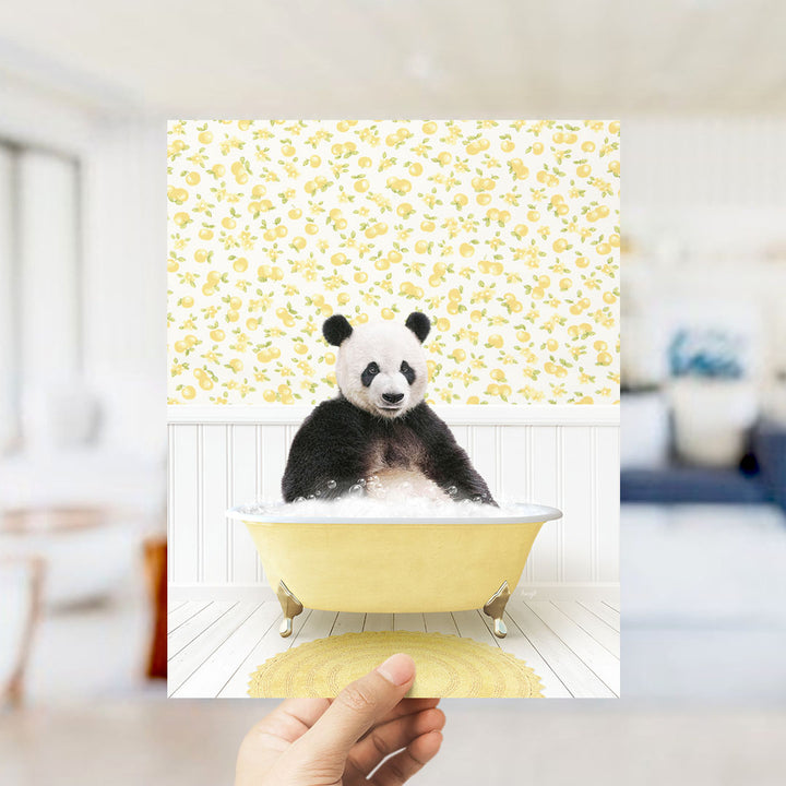A panda bear sitting in a yellow bathtub filled with bubbles, surrounded by a yellow and white floral pattern on the wall.