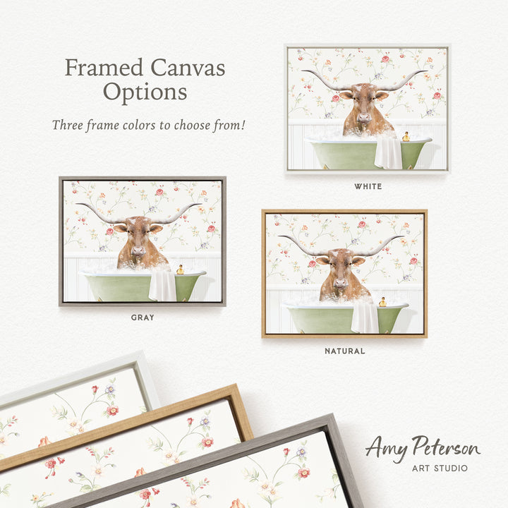 The image is a framed canvas with a picture of a cow sitting in a bathtub, surrounded by floral wallpaper. There are three different frame options available, each with a different color: white, gray, and natural. The text indicates that the canvas is framed with three frame colors to choose from.
