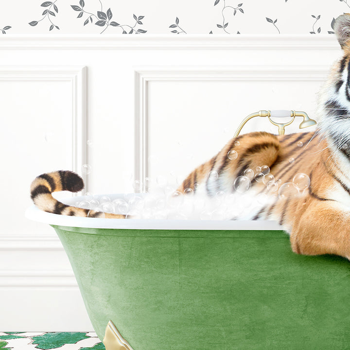 a stuffed tiger sitting in a bathtub filled with bubbles