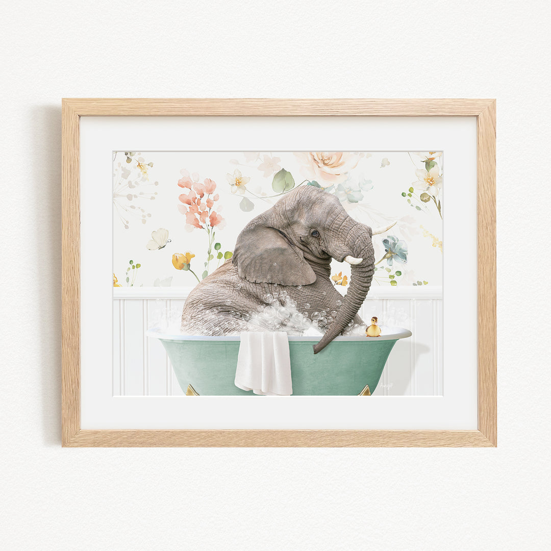 A gray elephant is sitting in a green bathtub filled with water, surrounded by flowers and other decorative elements.