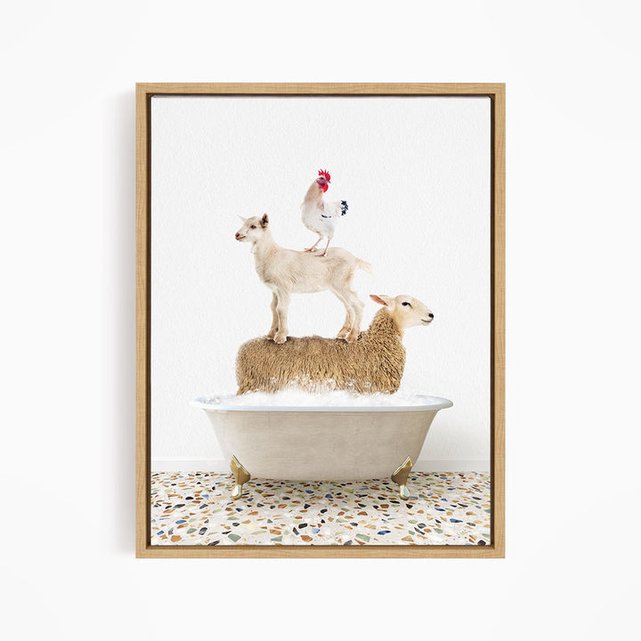 A framed image depicting a sheep standing on a goat's back while a chicken stands on top of a sheep in a bathtub.