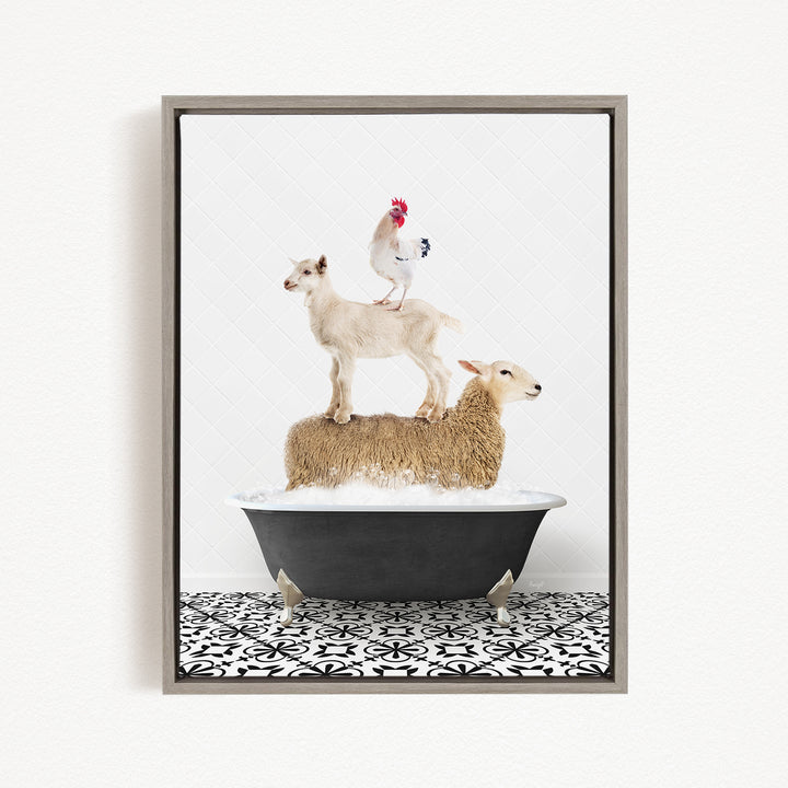A framed image depicting a sheep standing on a goat's back while a rooster stands on top of a sheep in a bathtub.