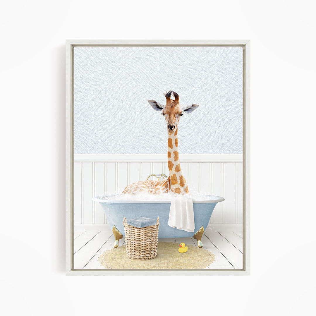 A giraffe sitting in a blue bathtub filled with water, surrounded by a yellow rubber duck and a wicker basket.