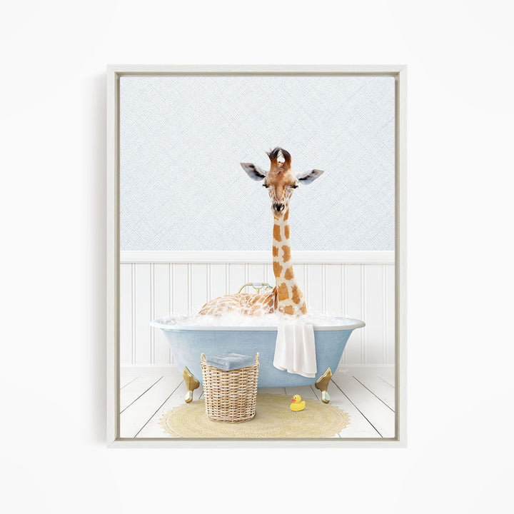 A giraffe sitting in a blue bathtub filled with water, surrounded by a yellow rubber duck and a wicker basket.
