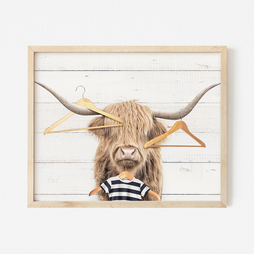 a picture of a bull with a pair of scissors on it's head