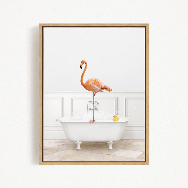A flamingo standing on the edge of a white bathtub filled with water, with a rubber duck floating in the water.