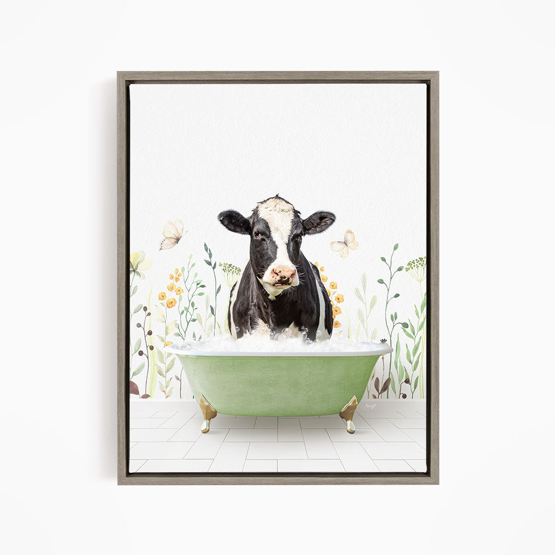 A black and white cow is sitting in a green bathtub filled with water, surrounded by flowers and butterflies.