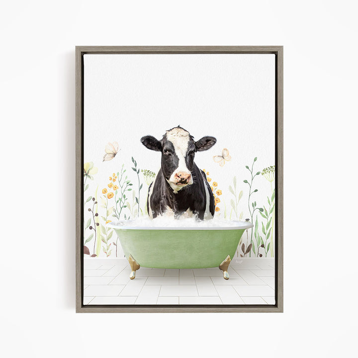 A black and white cow is sitting in a green bathtub filled with water, surrounded by flowers and butterflies.