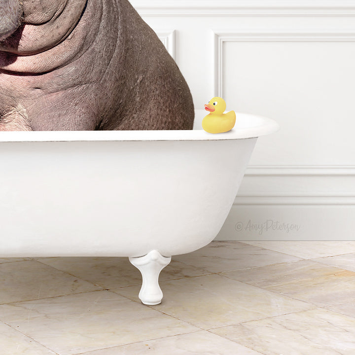 A large hippopotamus is sitting in a white bathtub, with a yellow rubber duck perched on the edge of the tub.