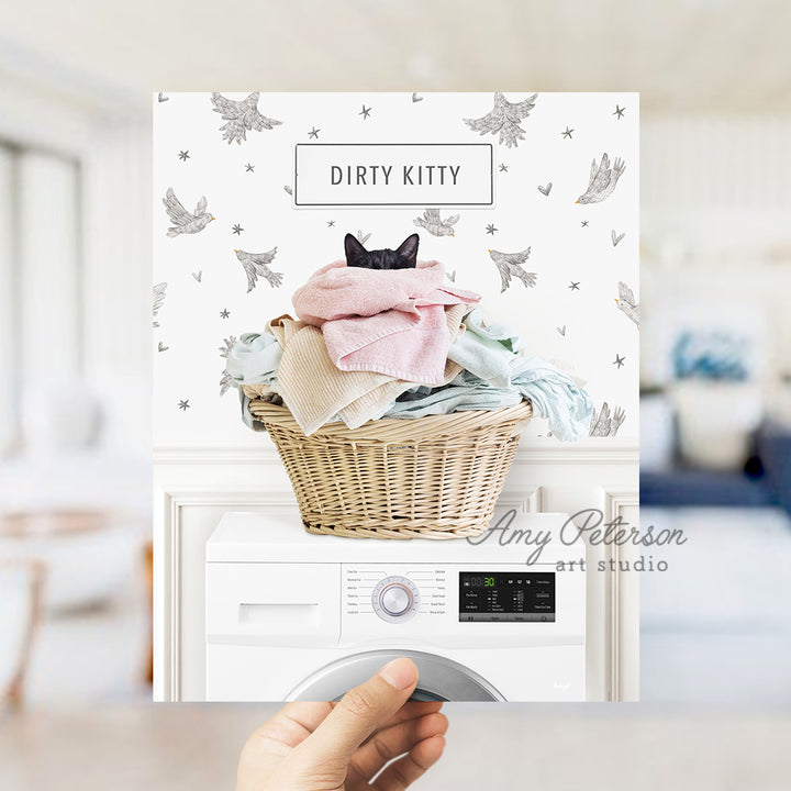 a person holding up a card with a laundry basket on top of it