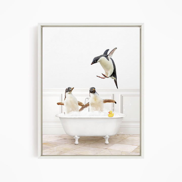 A framed image depicting three penguins sitting in a bathtub, with one penguin flying towards the others.