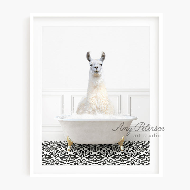 a llama sitting in a bathtub with foam on it