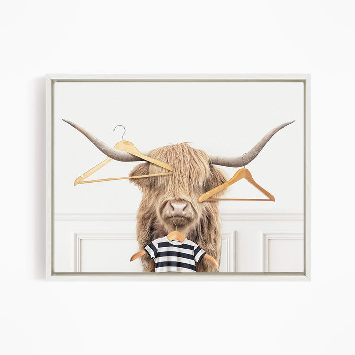 Highland Cow with Clothes Hangers - Simple White Wall