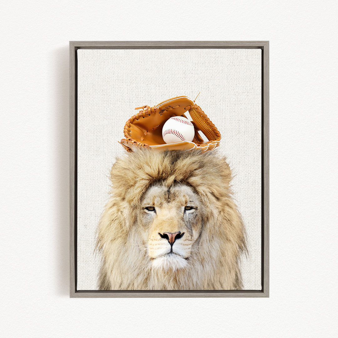 A lion wearing a baseball glove on its head, with a baseball resting on top of the glove.