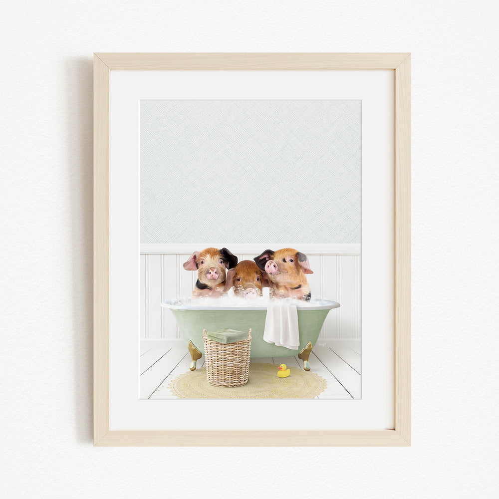 Three adorable pigs sitting in a green bathtub, enjoying a bubble bath together.