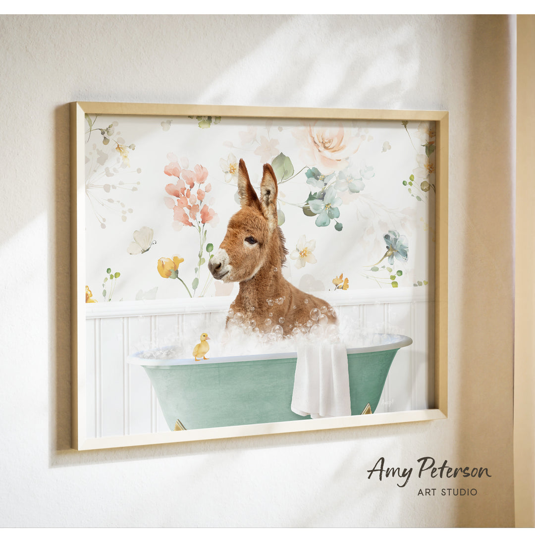 A donkey is sitting in a green bathtub filled with bubbles, surrounded by a floral pattern.
