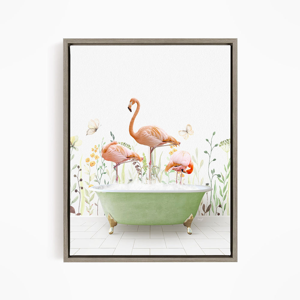 A framed image depicting three flamingos standing in a green bathtub filled with water, surrounded by flowers and butterflies.