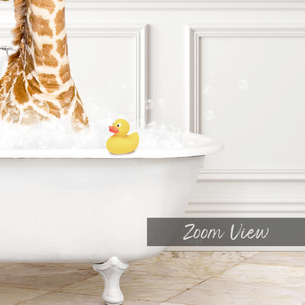 A yellow rubber duck sits in a white bathtub filled with bubbles, with a giraffe's head visible behind the tub.