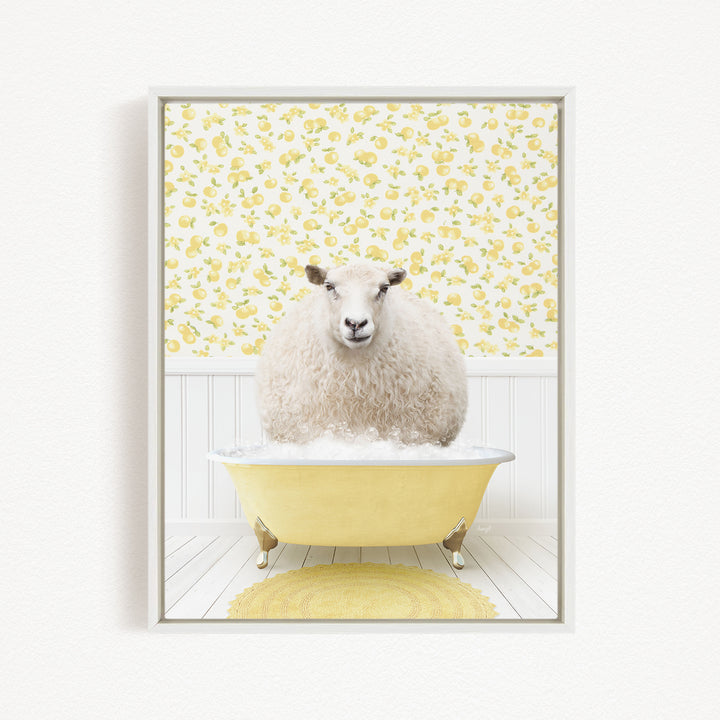 A fluffy white sheep sits in a yellow bathtub, surrounded by a yellow floral pattern on the wall behind it.