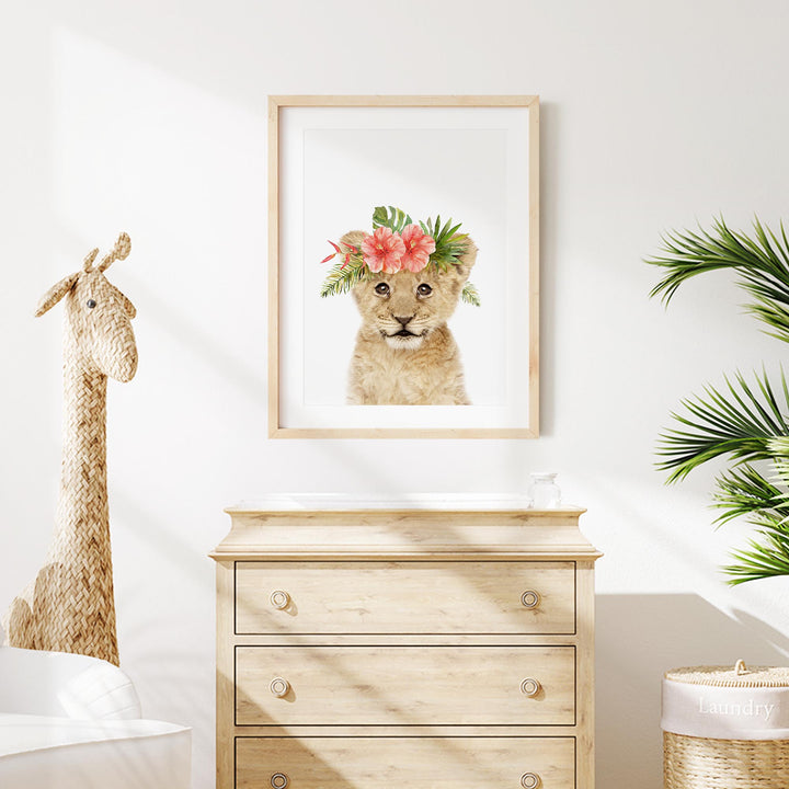 a picture of a giraffe with a flower crown on its head