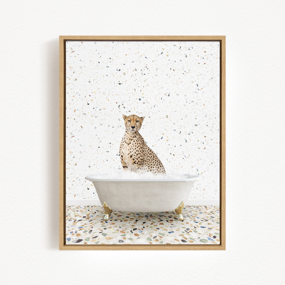 A cheetah sitting in a white bathtub filled with water, surrounded by a speckled tiled floor.