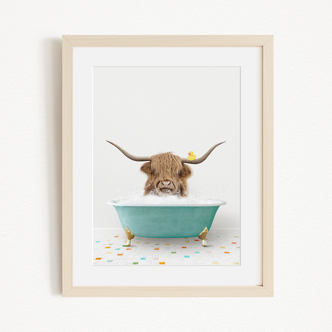 A brown cow with long horns is sitting in a blue bathtub, with a yellow rubber duck floating on the water.