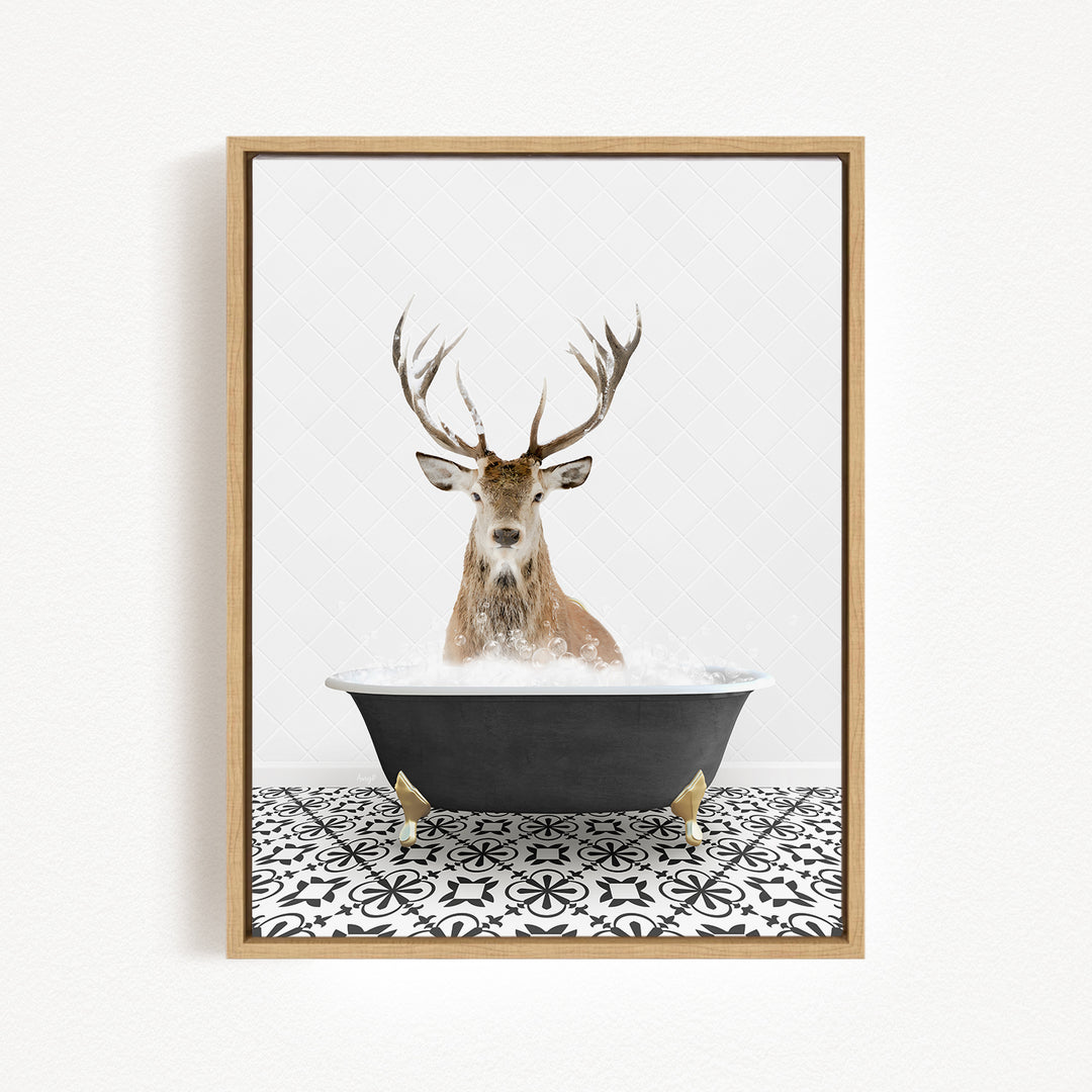 A deer with large antlers is sitting in a bathtub filled with water, creating a whimsical and unexpected scene.