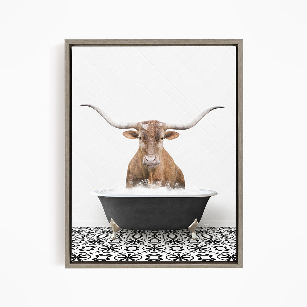 A brown cow with large horns is sitting in a black bathtub filled with water, creating a whimsical and humorous scene.