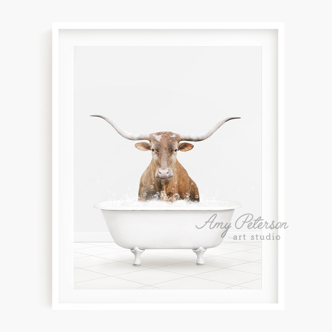 a bull with long horns sitting in a bathtub