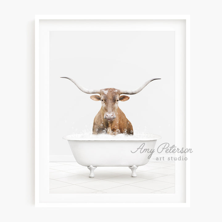 a bull with long horns sitting in a bathtub