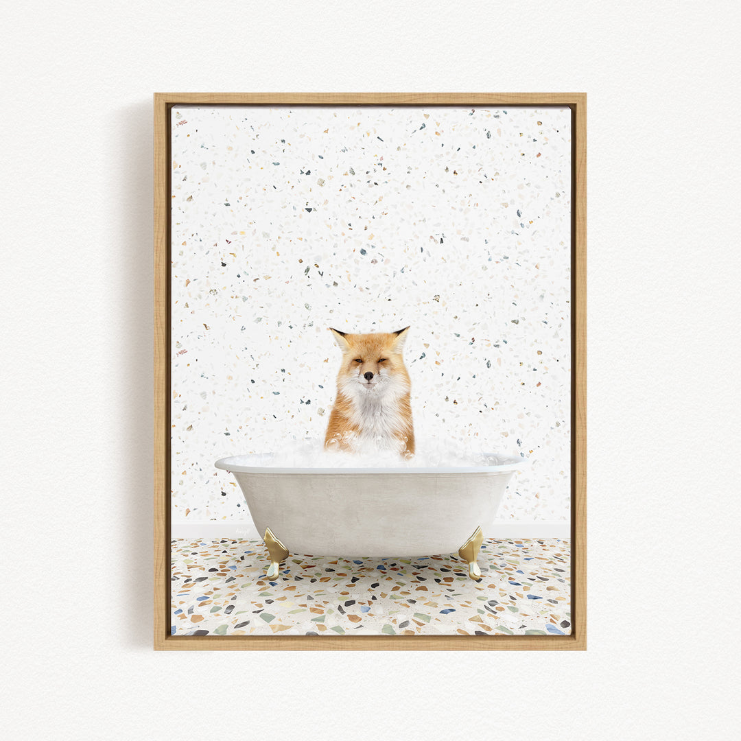A fox is sitting in a white bathtub filled with bubbles, surrounded by a speckled tiled floor.
