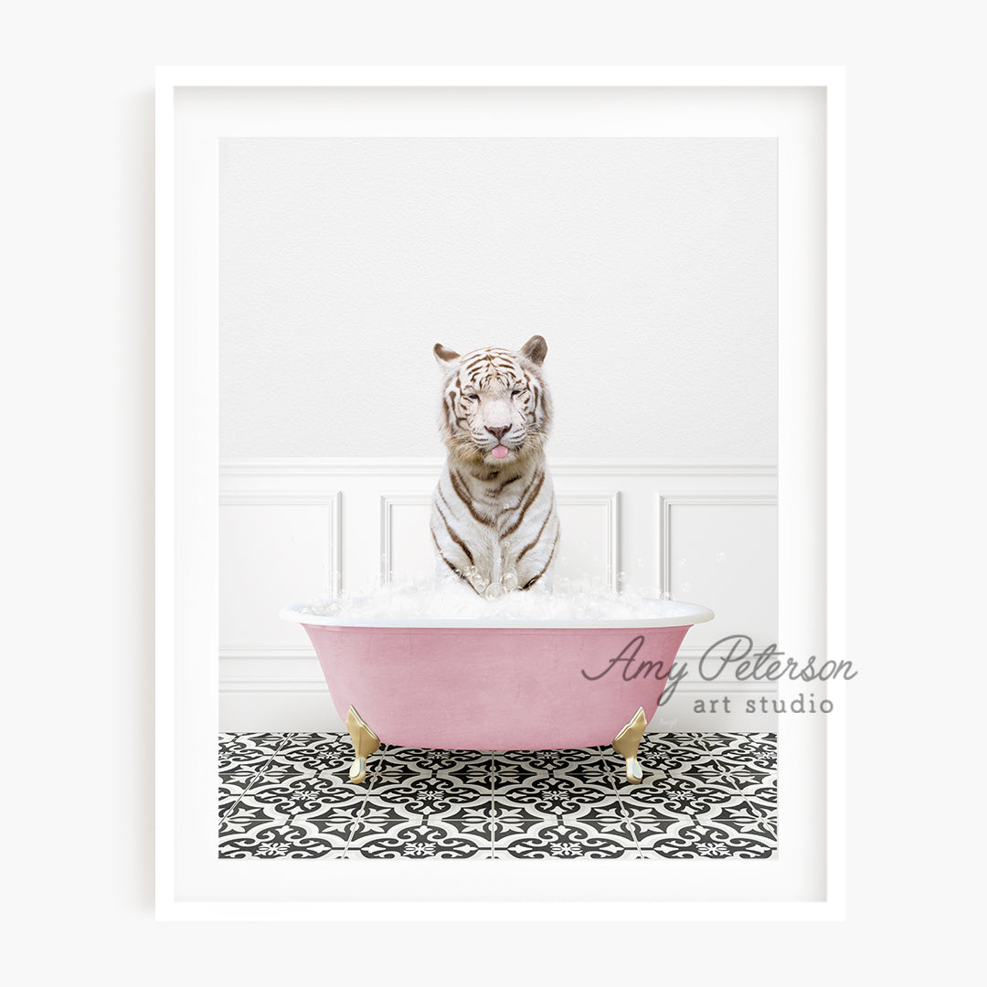 a white tiger sitting in a pink bath tub