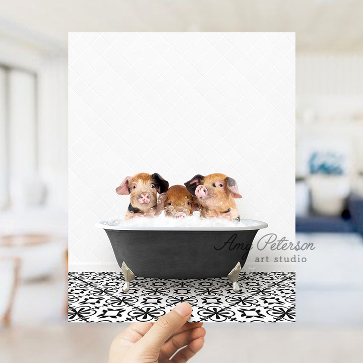 a person holding up a card with two small dogs in a bathtub