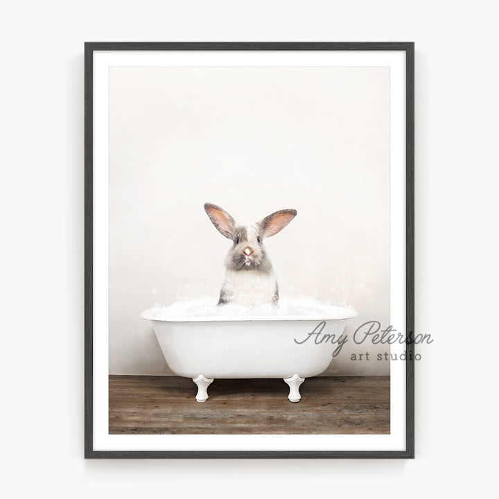 a rabbit is sitting in a bathtub with foam