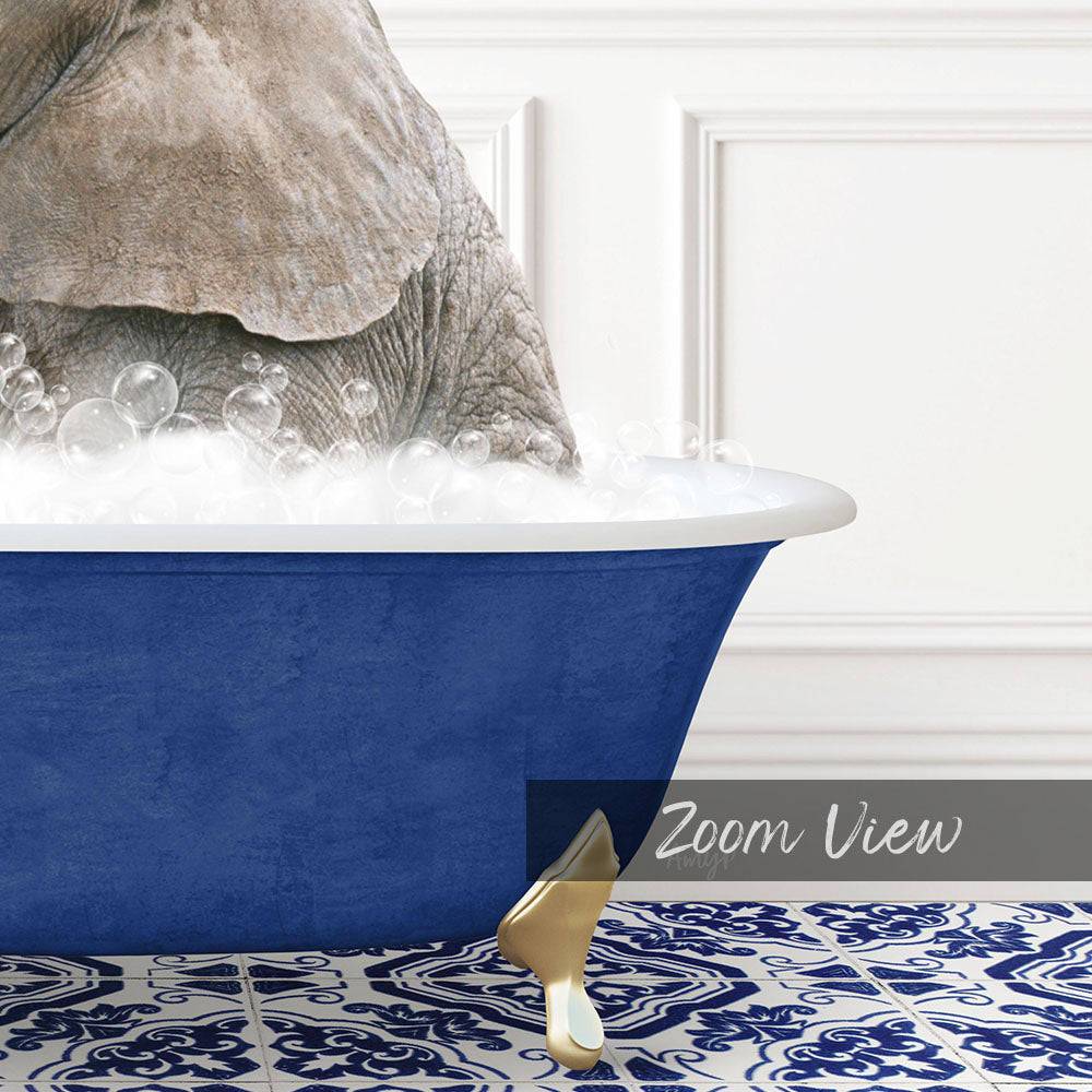 A large blue bathtub filled with soapy water, with a gold faucet and a gold bathtub leg visible.