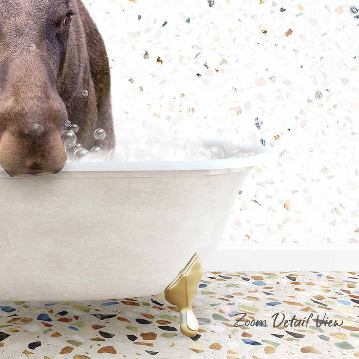 A dog is sitting in a bathtub filled with water, surrounded by bubbles, with a mosaic floor in the background.