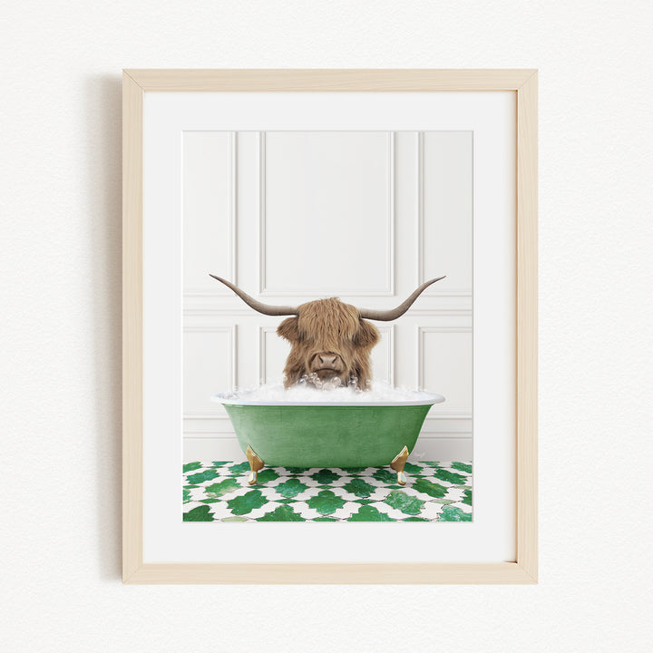 A brown cow with long horns is sitting in a green bathtub filled with water, surrounded by a green and white patterned rug.