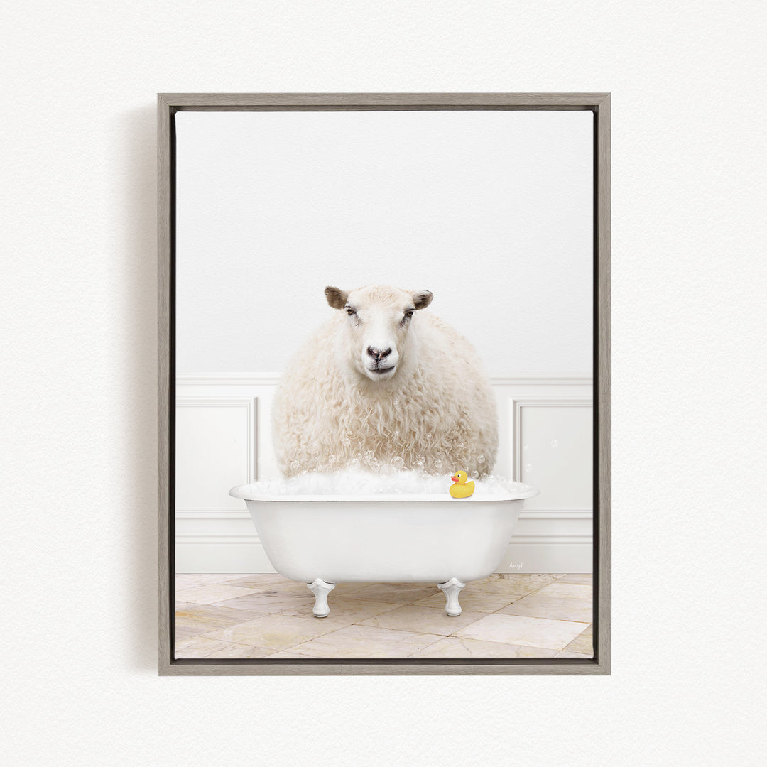 A fluffy white sheep sits in a white bathtub filled with bubbles, with a yellow rubber duck floating in the water.