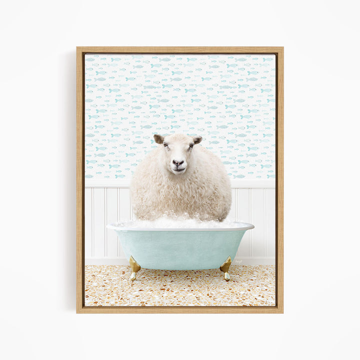 A fluffy white sheep sits in a blue bathtub filled with bubbles, surrounded by a patterned wall and a tiled floor.
