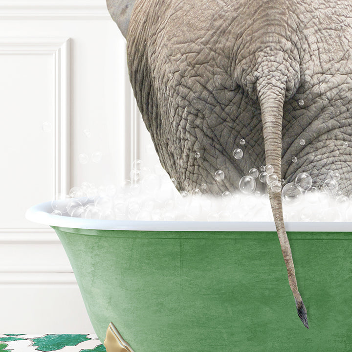 an elephant taking a bath in a green bathtub