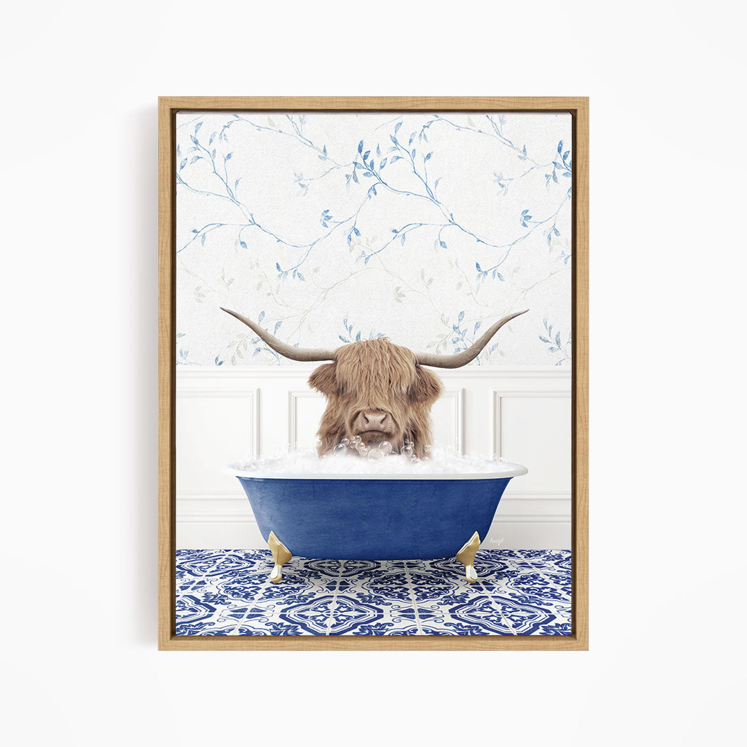 A brown cow with long horns is sitting in a blue bathtub filled with water, surrounded by a blue and white patterned rug.