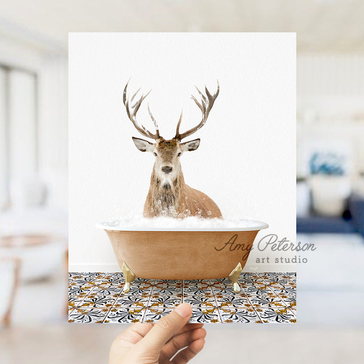 a hand holding a card with a picture of a deer in a bathtub