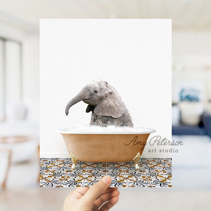 a person holding a card with a picture of a baby elephant in a bathtub