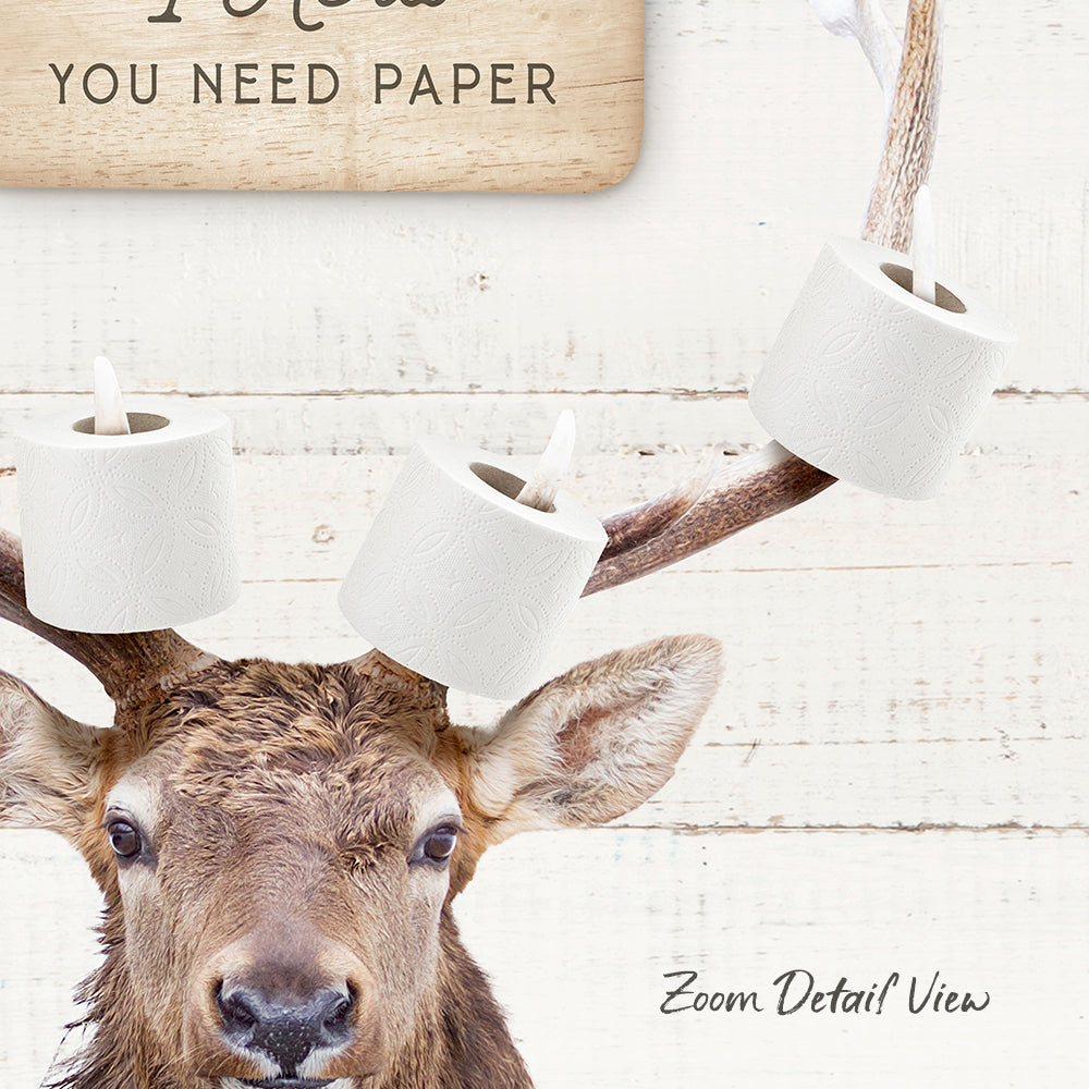 A deer with antlers and a sign that says "You need paper" in the background.