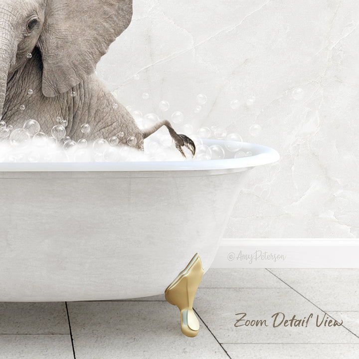 A large elephant is sitting in a white bathtub filled with bubbles, creating a whimsical and playful scene.