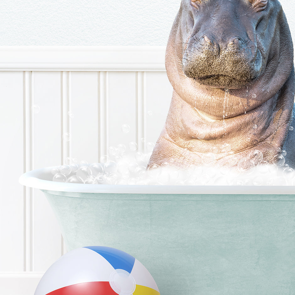 a hippo in a bathtub with a beach ball