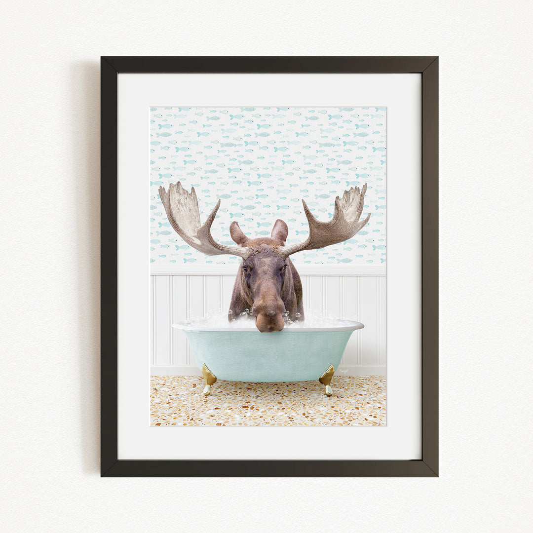 A moose with large antlers is sitting in a bathtub filled with water, surrounded by a patterned wall.