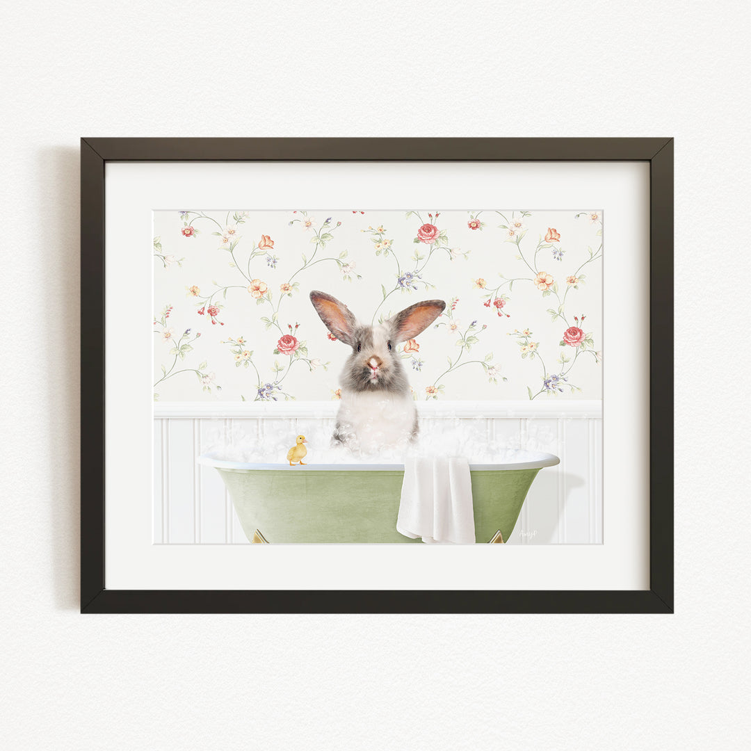 A cute rabbit sitting in a green bathtub filled with water, surrounded by a floral wallpaper.