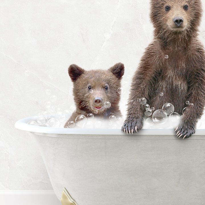 a couple of brown bears sitting inside of a bath tub