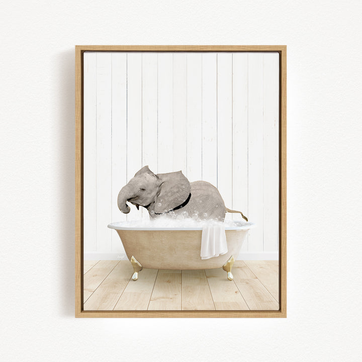 A gray elephant is sitting in a white bathtub filled with water, creating a whimsical and playful scene.